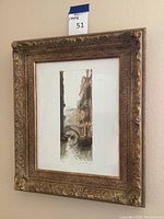 Front view of the framed Italian art print showing Venice canals scene with ornate gold-tone frame and white matting.