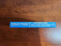 Spine of the book 'Captain's Peril' by William Shatner with 'Star Trek' in gold letters on blue spine.