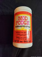 Photo of Mod Podge Gloss 32 fl oz bottle showing label and condition