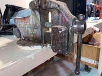Side view of Columbian Vice Co. model 44 bench vice showing its metal construction and wear.