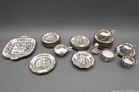 Overall view of assorted Coalport and Aynsley bone china dishes arranged