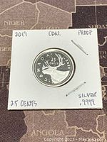 Obverse of 2019 Canadian silver proof 25 cent coin showing a caribou with denomination and Canada text.