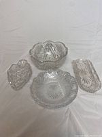 Full set of four leaded crystal serving dishes including a large fruit bowl, two crudite dishes, and one round serving dish arranged on white background.