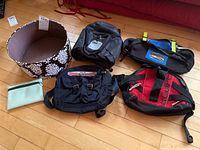 Wide shot of all bags and hat box on floor showing sizes and colors