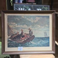 Front view of the framed Winslow Homer "Breezing Up" print showing sailing boys, frame wear, and print condition.
