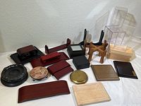 Photo showing all display stands and cases arranged on a white surface with wood and stone textures.
