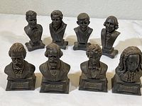 Photo showing nine small bust sculptures including Abraham Lincoln and assorted composers and presidents.