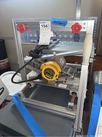 Front view of DeWalt router mounted to aluminum router table