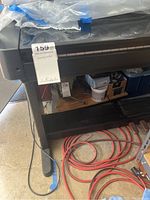 Front view showing keyboard on stand and metal legs