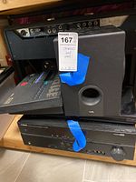 Shelf view showing tube amplifier head on top next to ported speaker cabinet, Samsung player and Yamaha receiver below