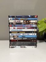 Stacked DVDs showing the spines and front covers, titles visible.