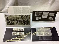Photo showing four mounted Canadian locomotive stamps on black card with rail track image and textual information card behind them