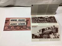 Open booklet showing black and white photos and historical descriptions of the locomotives featured on the stamps.