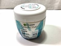Front view of Garnier SkinActive Hydrating Cream jar showing brand, product name, and key ingredients.