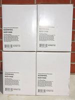 Four white toner cartridge boxes labeled 62D0HA0, 62D1H00, model NUPMX710X, stacked in two rows of two showing front labels.