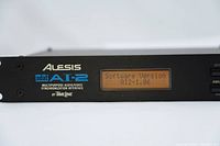 Front panel close-up showing brand, model, and software version displayed on LCD screen.