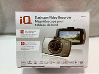 Photo of original packaging box with product image and key feature icons including 1080p, 30fps, 140° lens, IR sensor, G-sensor.