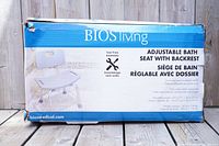Box for BIOSliving adjustable bath seat with backrest showing product name, features and weight capacity of 300 lbs.