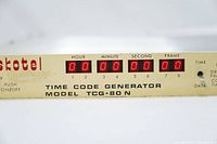 Front panel close-up showing Skotel branding, model TCG-80N, and numeric LED displays for time code (hour, minute, second, frame).