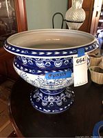 Full view of the ceramic planter showing its shape, size, and overall design