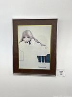 Full view of the framed print showing the artwork, matting, and frame.