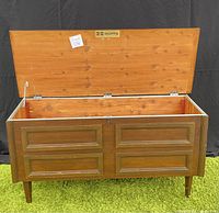Open cedar chest showing interior cedar wood lining and Huppe brand plaque inside lid.