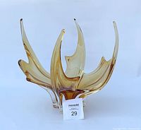 Front view of vintage Edag art glass centerpiece showing the elegant four tip design and gold color.