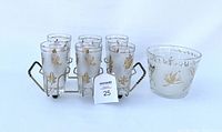 Full view of vintage 6 frosted glasses with gold leaf pattern in a metal caddy, and a frosted glass ice bucket with gold leaf decoration.