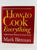 Front cover of 'How to Cook Everything' showing full title and author's name, red hardcover with yellow and white text.