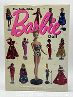 Front cover of the collectible Barbie book showing the title and images of various Barbie dolls in vintage outfits.
