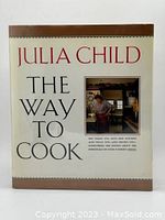Front cover of the hardcover cookbook 'The Way to Cook' by Julia Child showing title and author with a small photo of Julia Child in a kitchen.