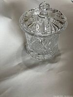 View of one heavy cut glass covered candy dish with lid.