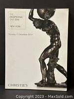 Front cover of the Christie's Exceptional Sale 2014 auction catalogue featuring a bronze statue of Atlas.