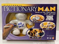 Front view of the original game box for Electronic Pictionary Man showing branding, tagline, and usage images.