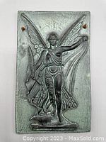 Front view of ceramic plaque showing winged Victory figure in relief