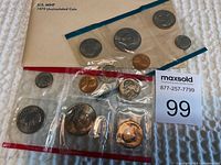 Photo showing the 1979 U.S. Mint uncirculated coin set complete with six coins sealed in plastic panels with original envelope.