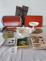 Full lot view showing all trays, bowls, decorative tiles and box included in the lot.