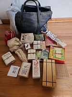Full view of the vintage magic set with black carrying case and multiple trick boxes and props on the floor.
