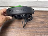 Side view of the padded black headband showing the 'Pioneer DJ' logo embossed in black.