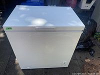 Closed white Amana chest freezer front view