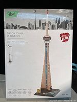 Front of the Dragon Block CN Tower box showing image of the assembled tower model with city skyline background and product details.