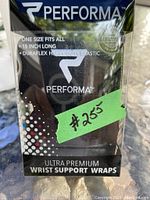 Photo of Performa Ultra Premium wrist support wraps packaged in original clear box with price tag showing $23.5.