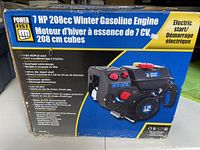 Box front showing Power Fist 7 HP 208cc winter gasoline engine with electric start, pull start, and main features described.