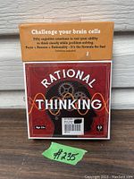 Front view of the boxed Rational Thinking mind game showing the logo and brain gears graphic.