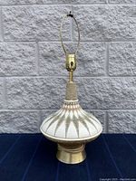 Full view of the mid-century modern ceramic base lamp showing overall shape and brass socket hardware.