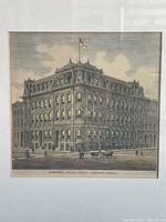 Close-up of the engraving showing the British America Assurance Company building with architectural details and flag, dated 1877.
