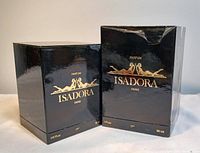 Two black glossy boxes for 30 ml and 15 ml Isadora Paris Parfum side by side.