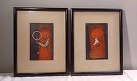 Pair of framed prints side by side on white surface