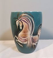 Front view of the Sascha Brastoff ceramic vase showing prancing horse design with gold lustre accents.
