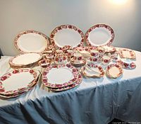 Wide view of entire china set displayed on table.